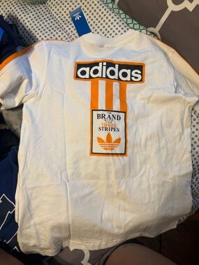 adidas White and Orange Graphic Retro Logo Tee with shorts